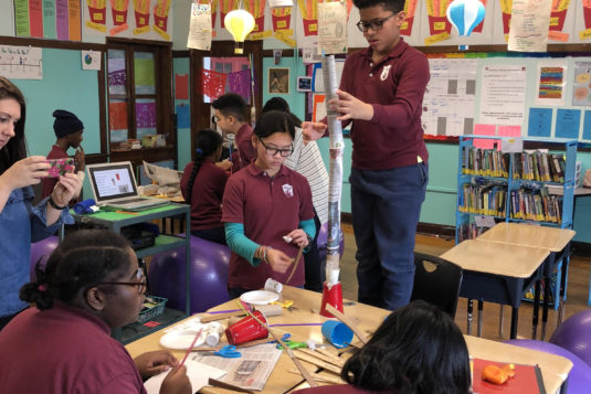 children building a tower together